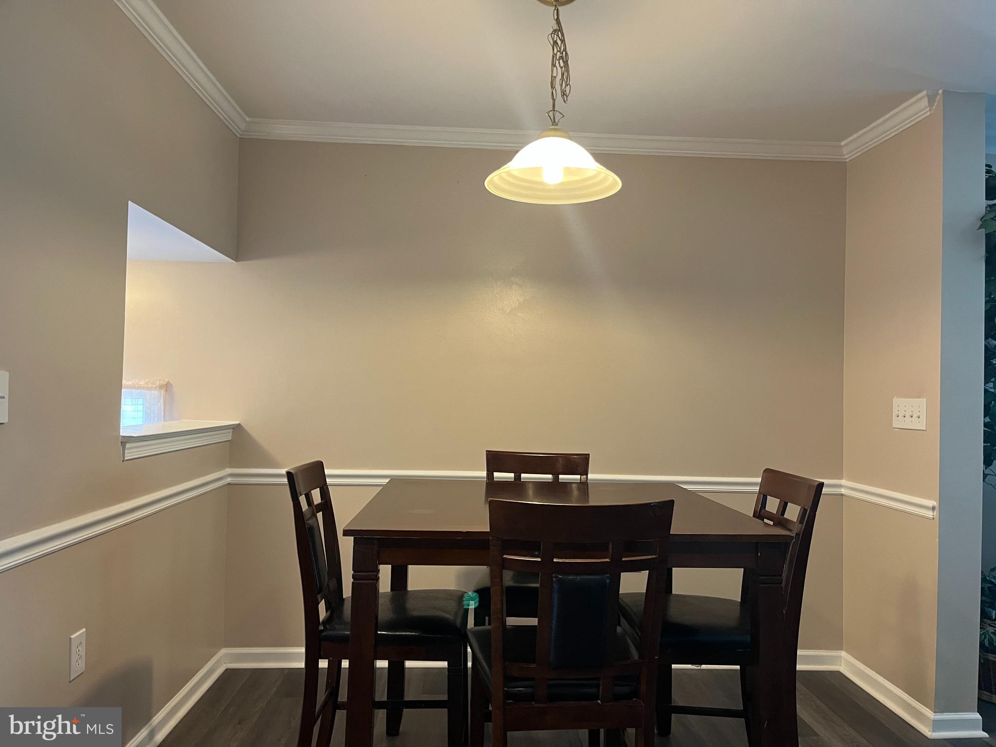 199 Rumbling Rock Road Hedgesville, WV 25427 - Photo 6 of 44 a view of a dining room with a table and chairs