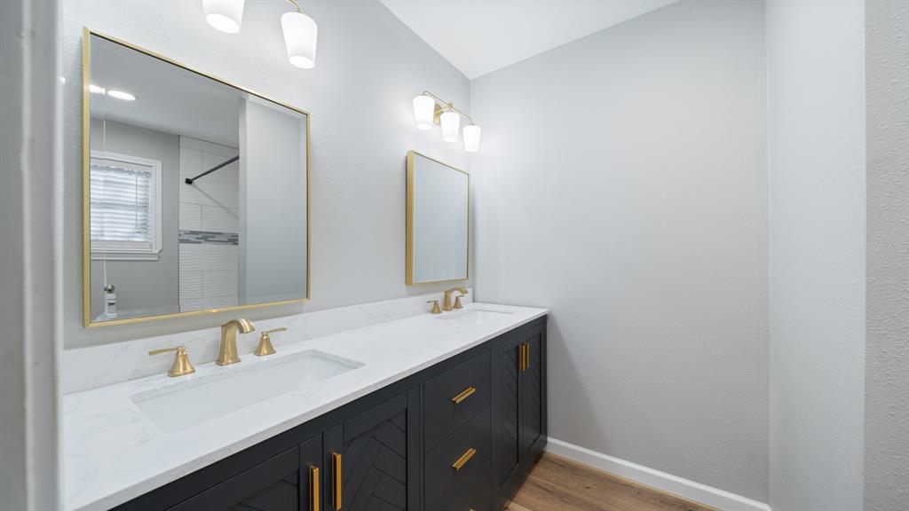 104 Joe Prince Drive Athens, TX 75751 - Photo 14 of 22 a bathroom with a double vanity sink and a mirror
