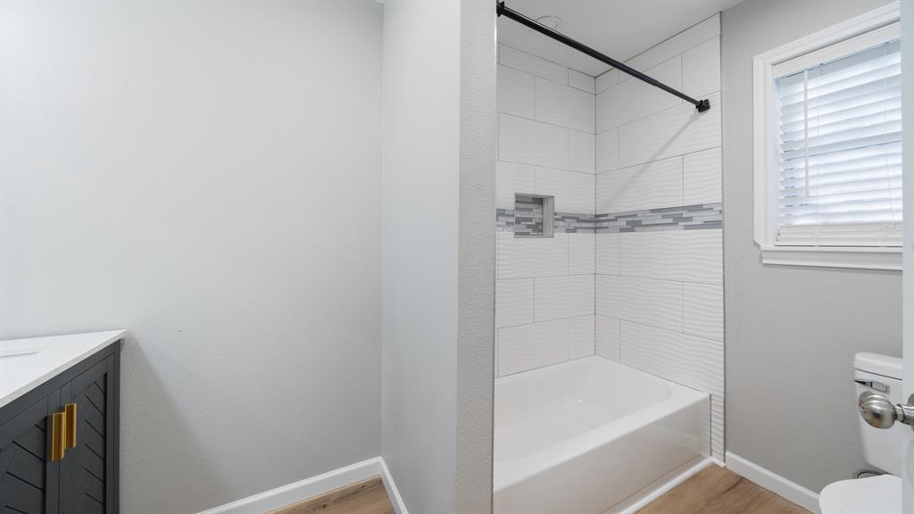 104 Joe Prince Drive Athens, TX 75751 - Photo 15 of 22 a bathroom with a bathtub and a toilet