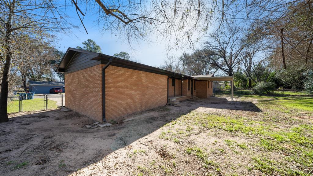 104 Joe Prince Drive Athens, TX 75751 - Photo 21 of 22 a view of a house with backyard and tree