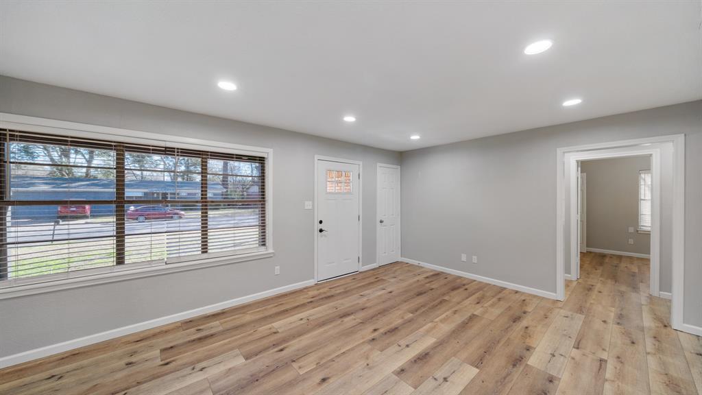 104 Joe Prince Drive Athens, TX 75751 - Photo 6 of 22 a view of empty room with wooden floor and fan