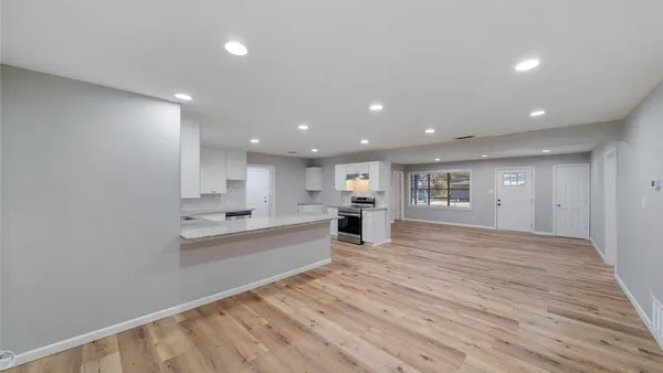 a view of kitchen with wooden floor