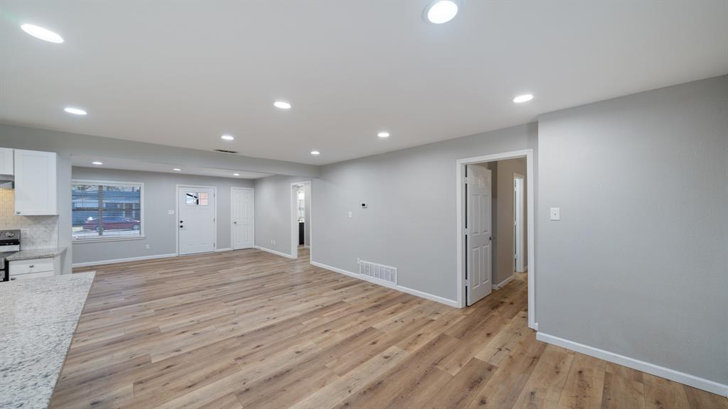 104 Joe Prince Drive Athens, TX 75751 - Photo 9 of 22 a view of an empty room with wooden floor and a window