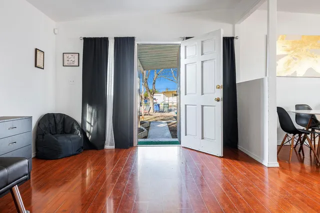 a bedroom with furniture and a window