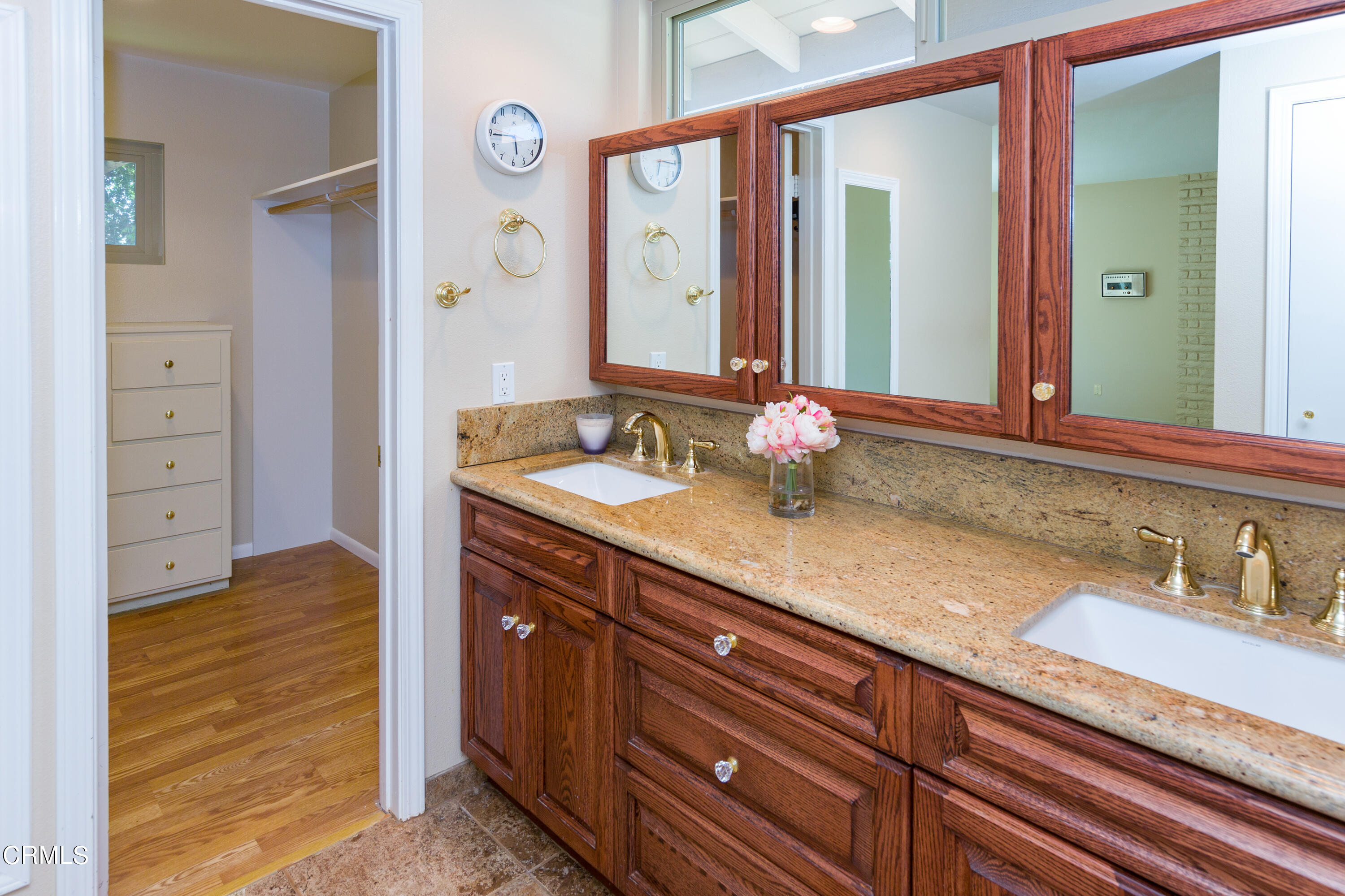 75 Vientos Road Camarillo, CA 93010 - Photo 18 of 36 a bathroom with a granite countertop sink and a mirror