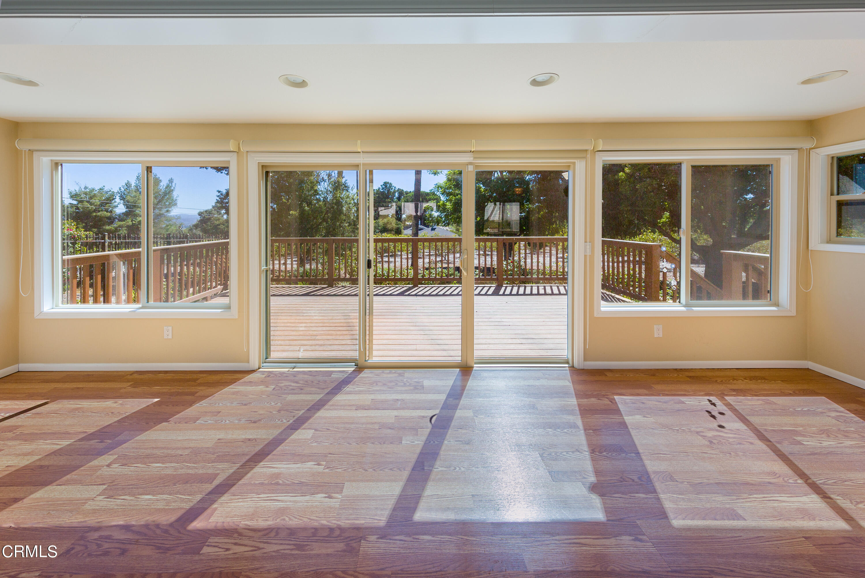75 Vientos Road Camarillo, CA 93010 - Photo 25 of 36 a view of an empty room with wooden floor and a window