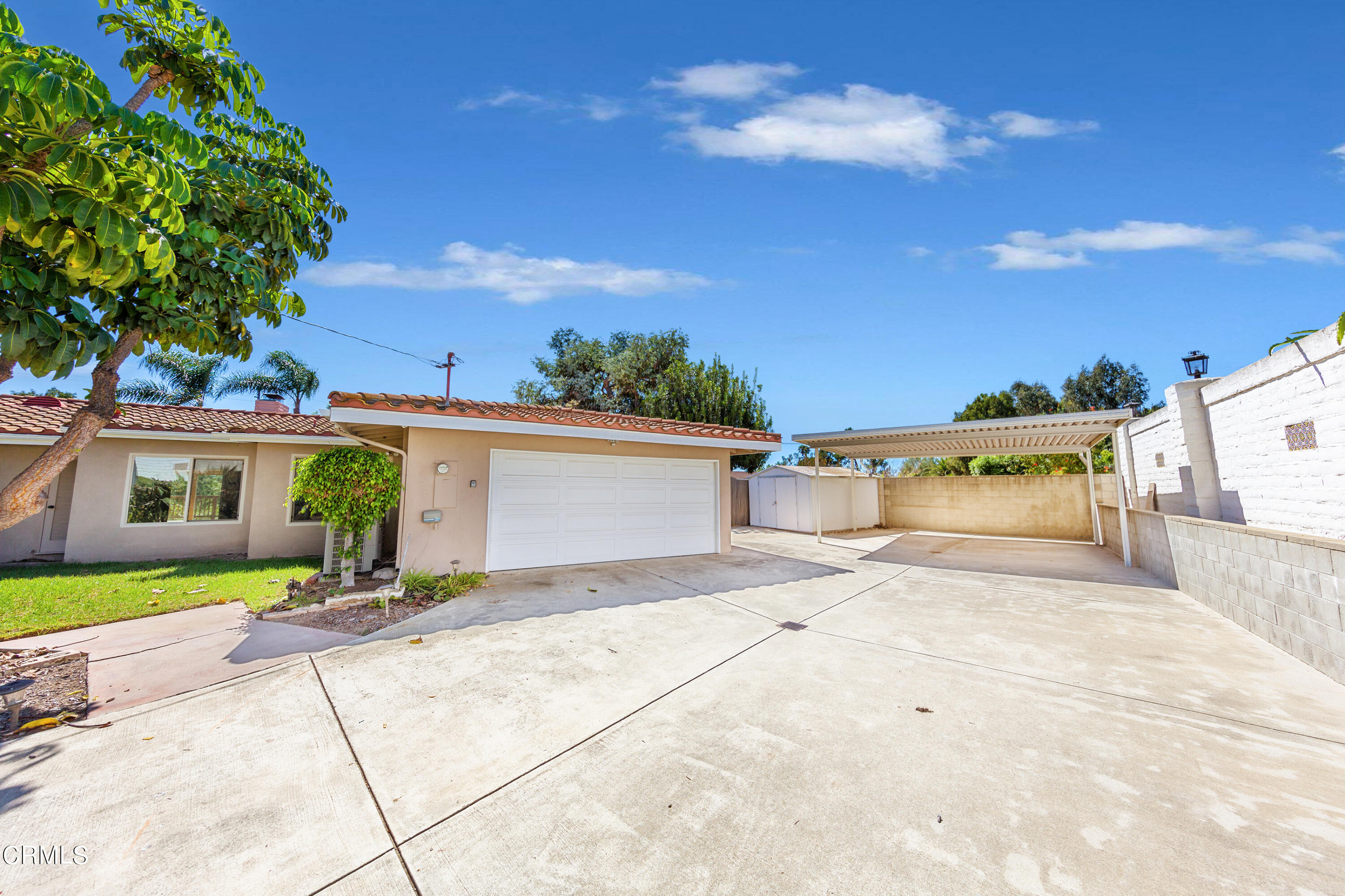 75 Vientos Road Camarillo, CA 93010 - Photo 30 of 36 a view of a house with a yard and large tree