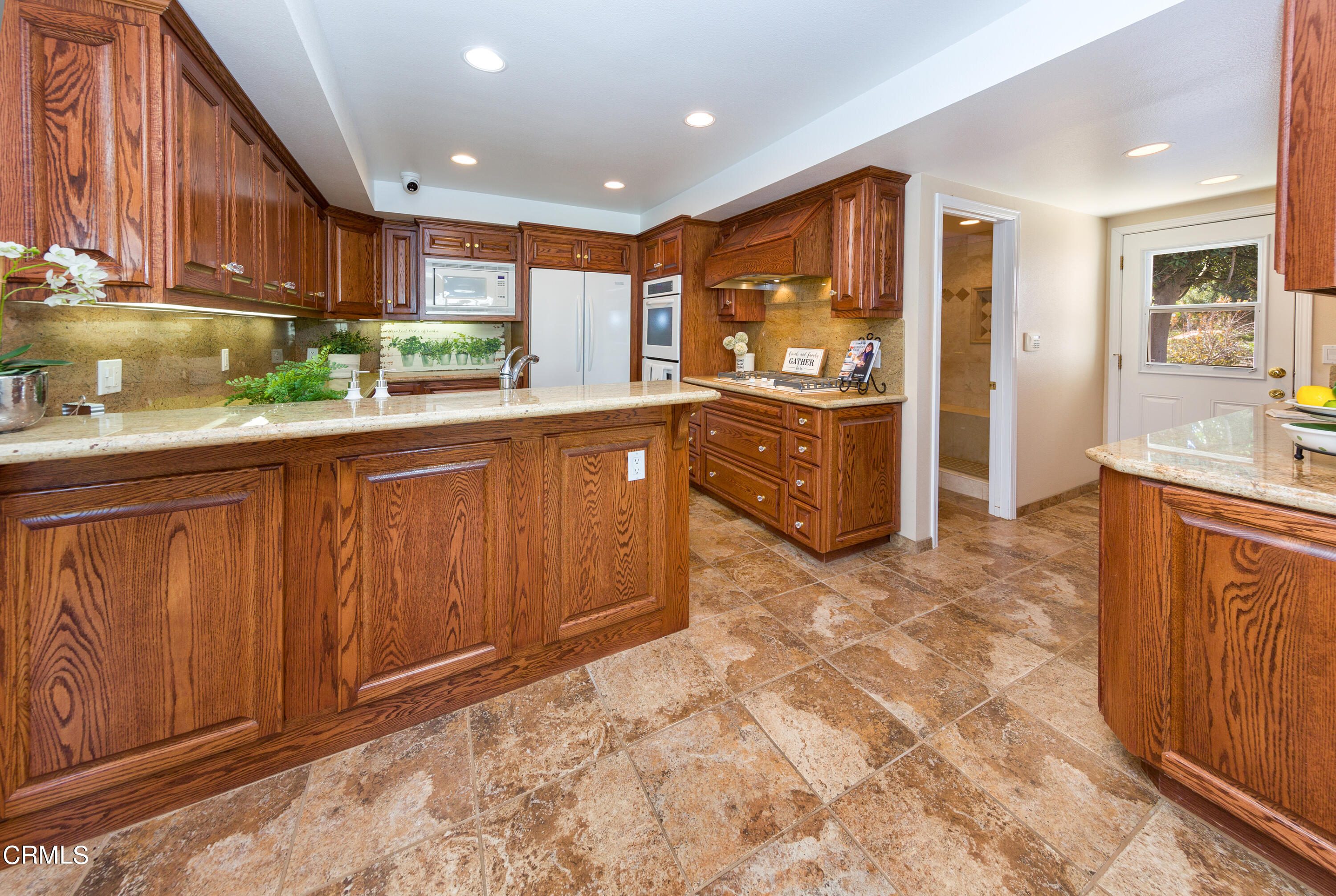 75 Vientos Road Camarillo, CA 93010 - Photo 9 of 36 a kitchen with stainless steel appliances granite countertop a refrigerator and a sink