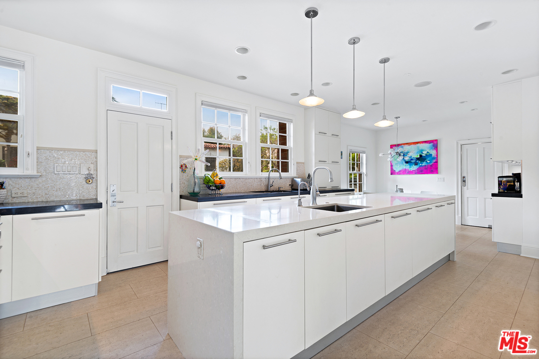 801 Devon Avenue Los Angeles, CA 90024 - Photo 11 of 25 a kitchen with counter top space and sink