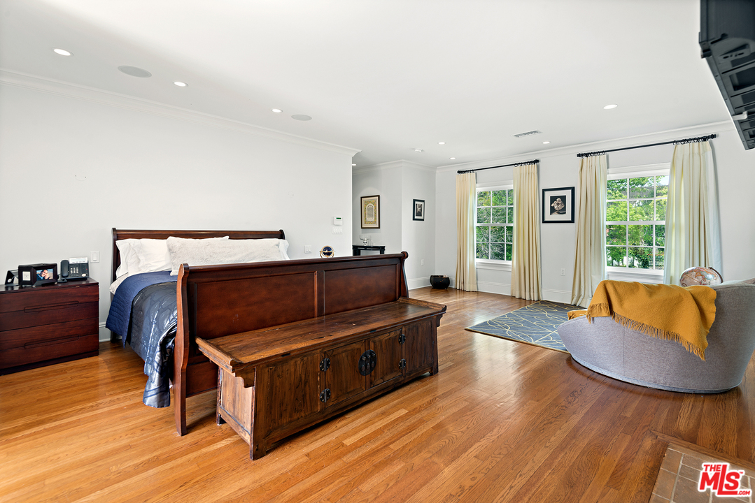 801 Devon Avenue Los Angeles, CA 90024 - Photo 17 of 25 a living room with furniture and a wooden floor