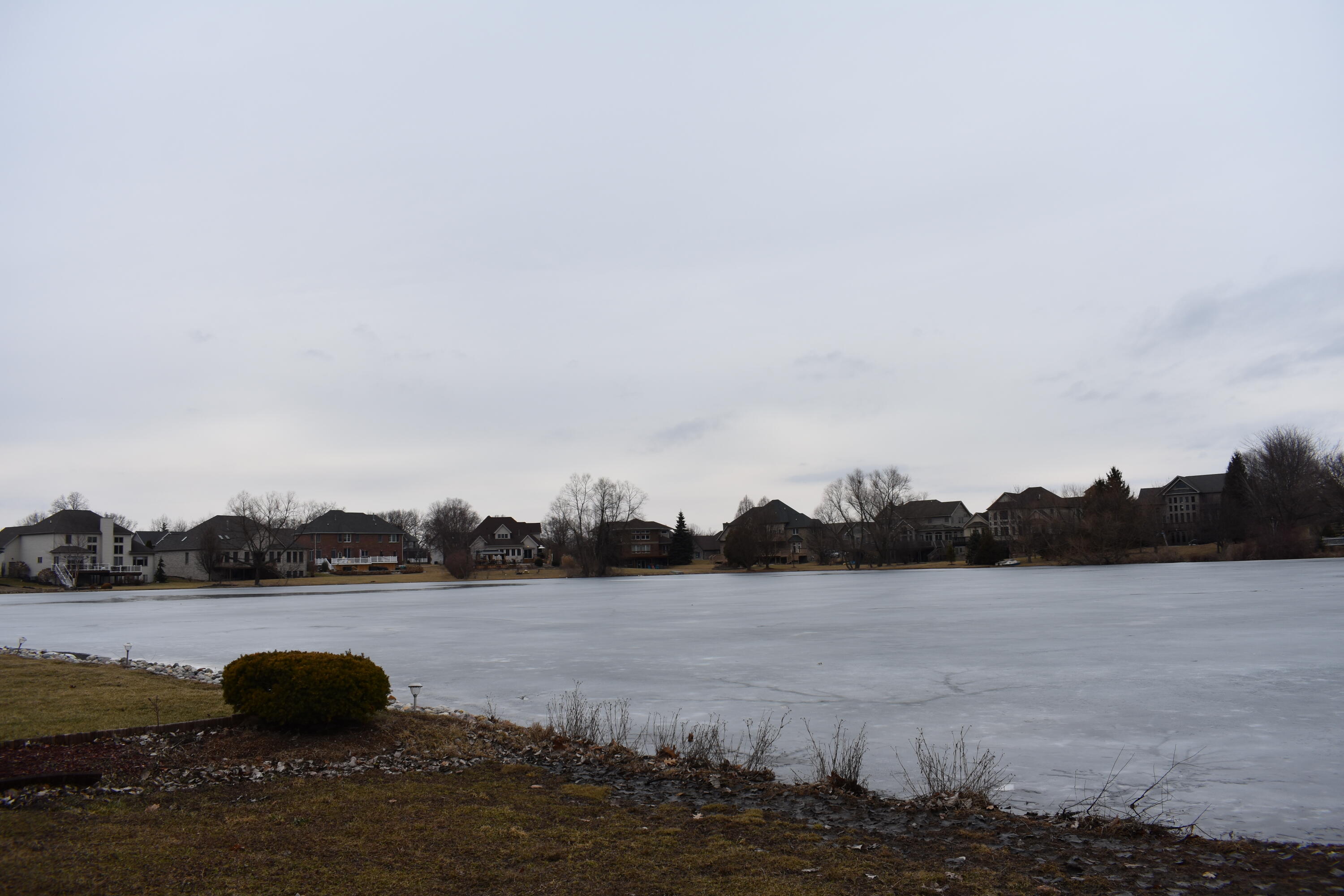 792 Cirque Drive Crown Point, IN 46307 - Photo 11 of 13 a view of a lake with houses in background