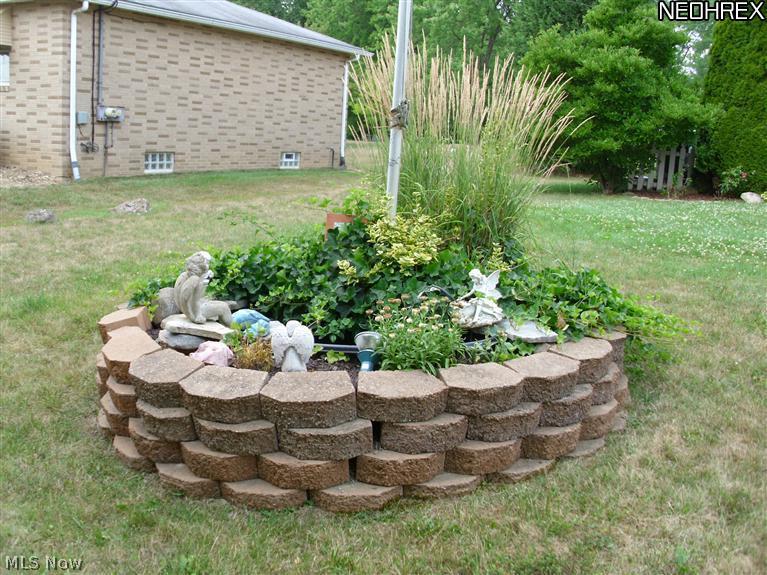 4076 Beckley Road Stow, OH 44224 - Photo 16 of 25 Gorgeous landscaping with a small pond.