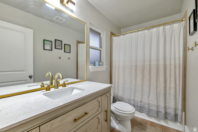 Undisclosed Address Ogden, UT 84403 - Photo 17 of 21 Full bathroom with vanity and shower / bathtub combination with curtain