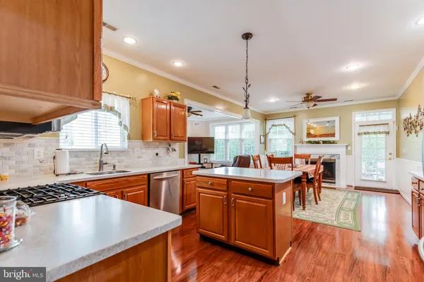 a kitchen with lots of counter top space and furniture