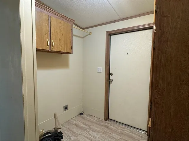 a view of a room that has a bed in it