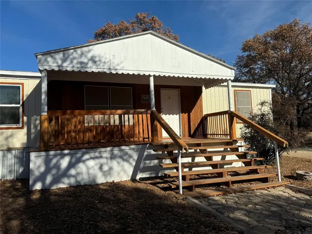a view of a house with large windows