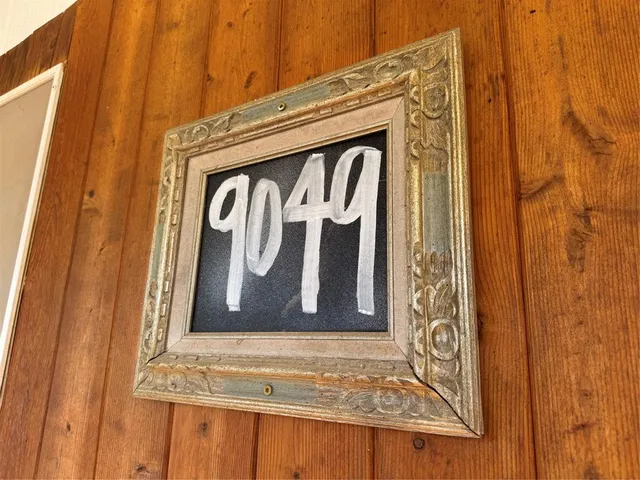 a view of door with wooden walls