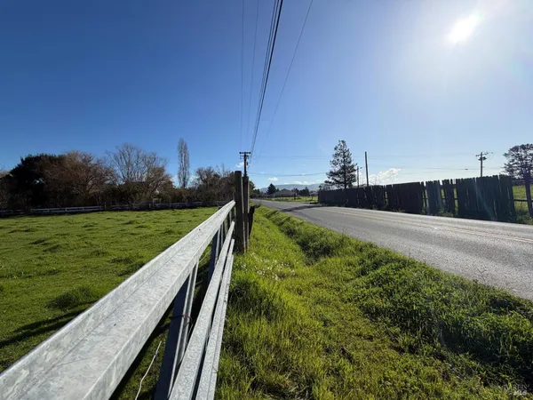 a view of a yard with an outdoor seating