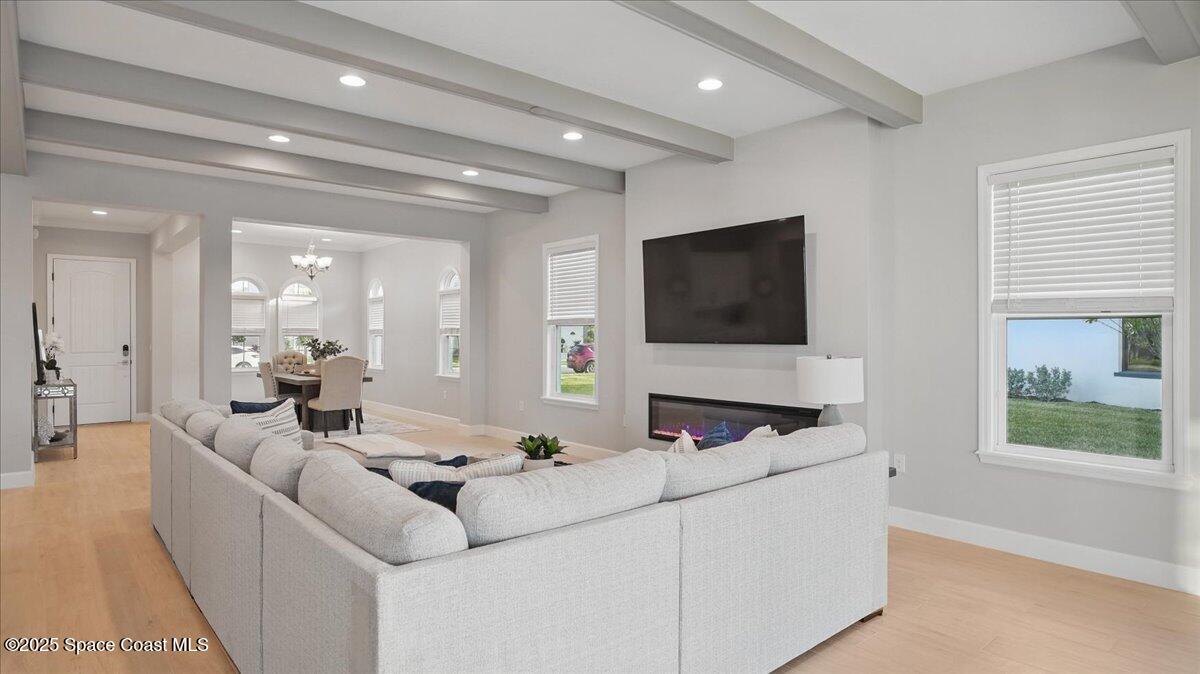 8348 Gullen Drive Melbourne, FL 32940 - Photo 11 of 58 a living room with furniture and a flat screen tv