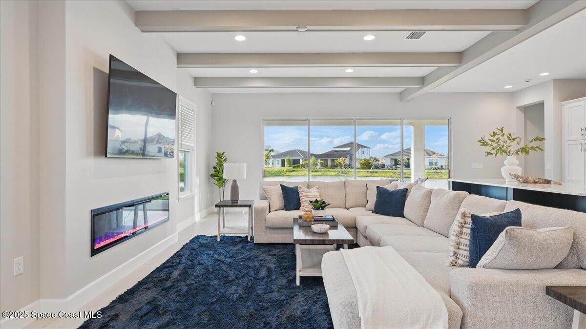 8348 Gullen Drive Melbourne, FL 32940 - Photo 12 of 58 a living room with furniture and a large window