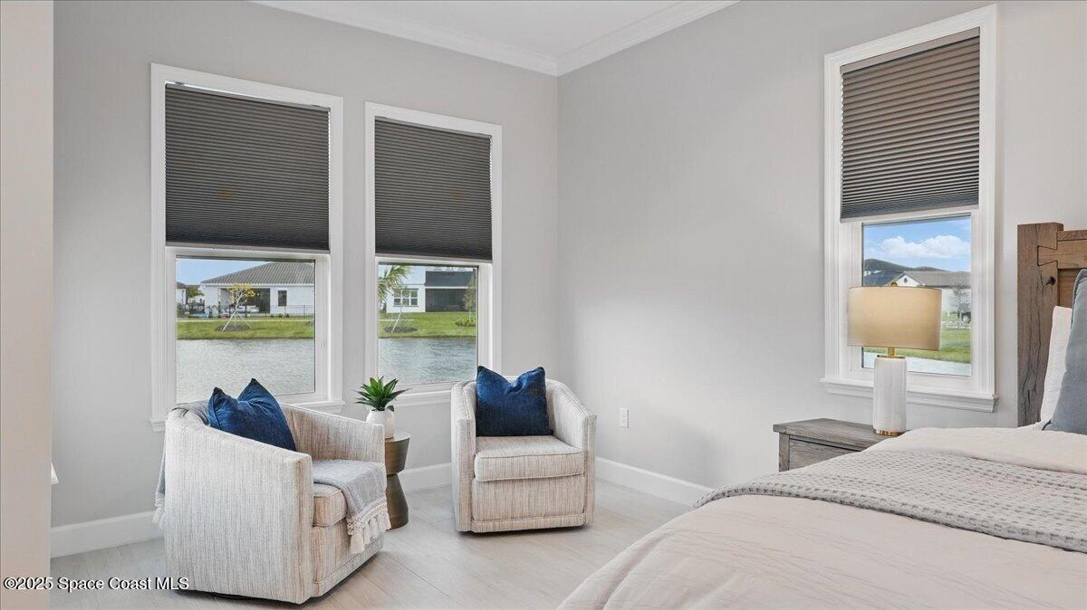 8348 Gullen Drive Melbourne, FL 32940 - Photo 26 of 58 a bedroom with furniture and a large window