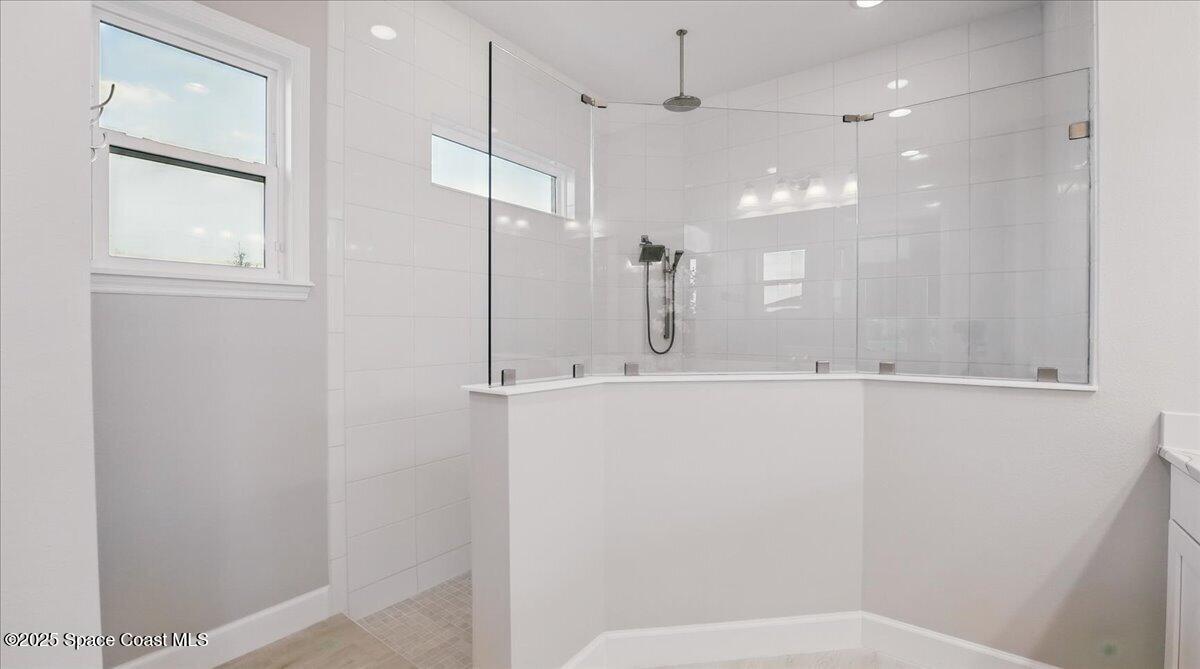 8348 Gullen Drive Melbourne, FL 32940 - Photo 30 of 58 a bathroom with a shower and a sink