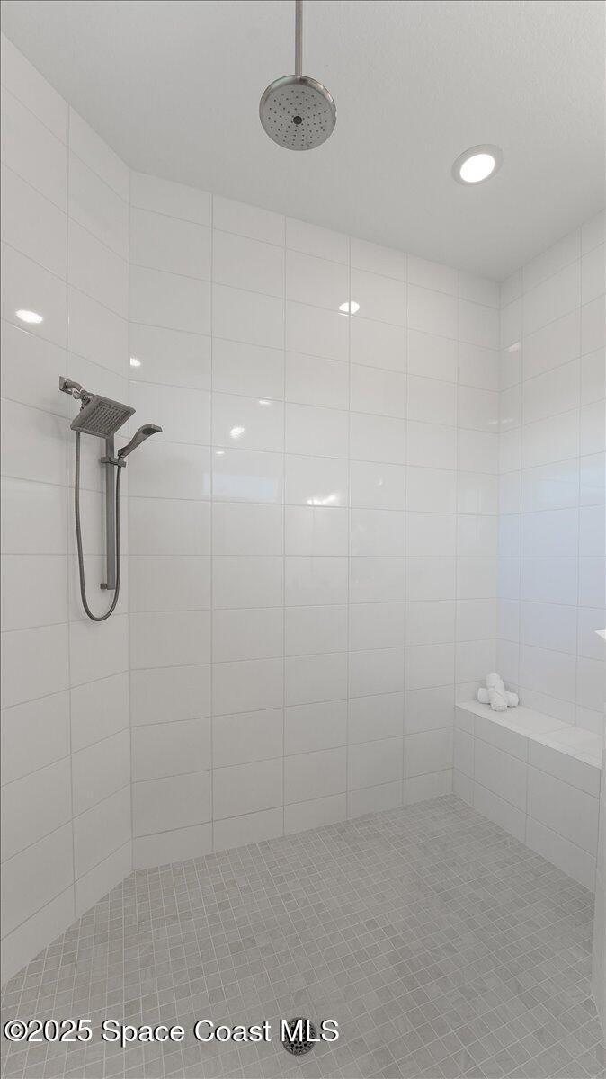 8348 Gullen Drive Melbourne, FL 32940 - Photo 31 of 58 a bathroom with a shower