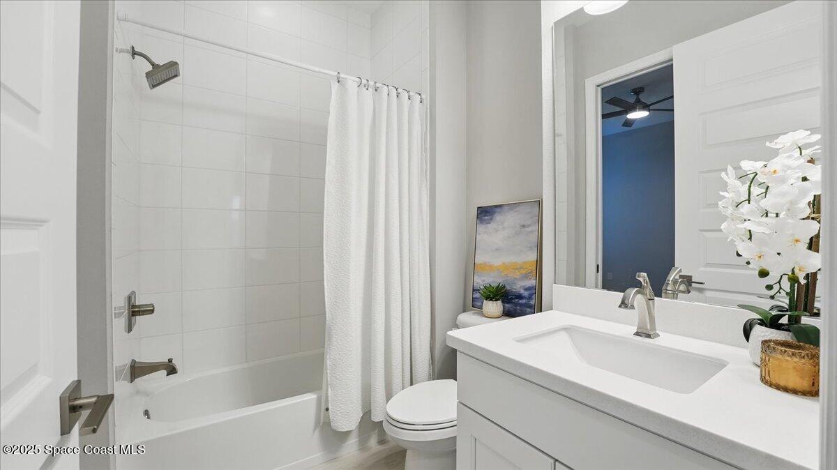 8348 Gullen Drive Melbourne, FL 32940 - Photo 35 of 58 a bathroom with a sink a toilet and shower
