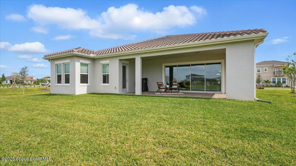 8348 Gullen Drive Melbourne, FL 32940 - Photo 38 of 58 a view of a house with a backyard