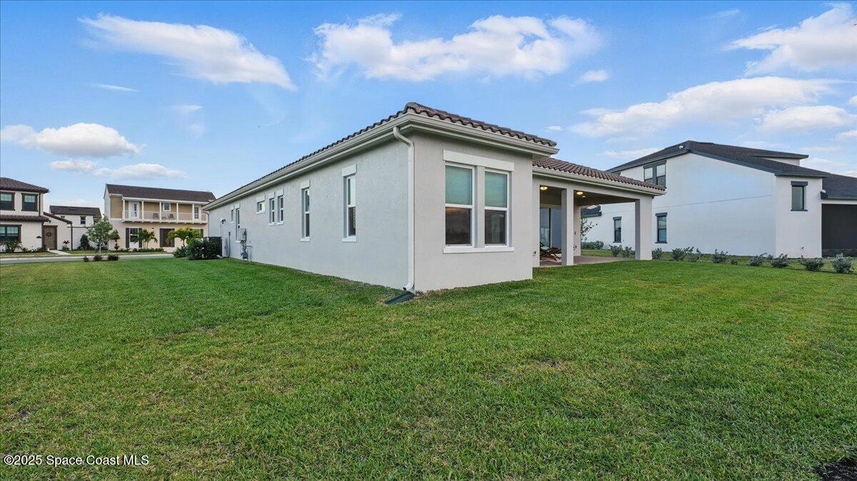 8348 Gullen Drive Melbourne, FL 32940 - Photo 41 of 58 a view of an house with backyard and garden