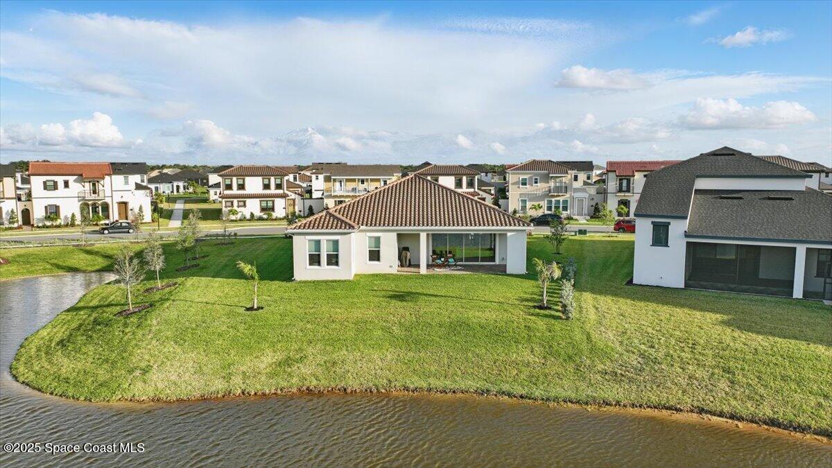 8348 Gullen Drive Melbourne, FL 32940 - Photo 48 of 58 a view of a house with a yard porch and sitting area