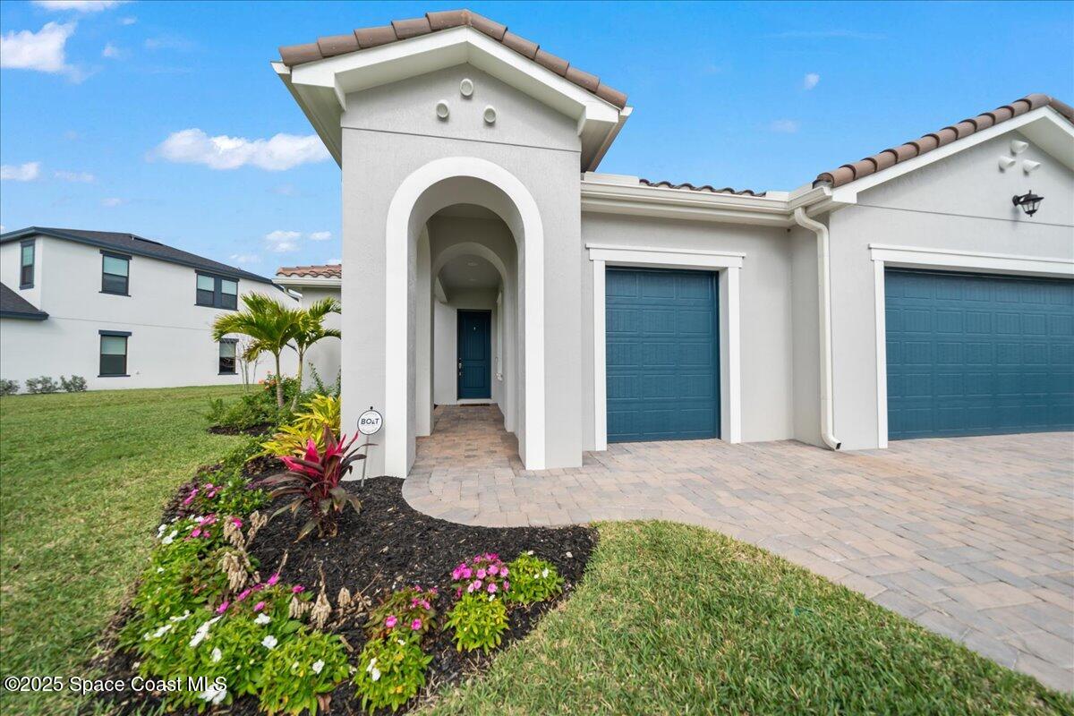8348 Gullen Drive Melbourne, FL 32940 - Photo 6 of 58 a view of entryway with garden