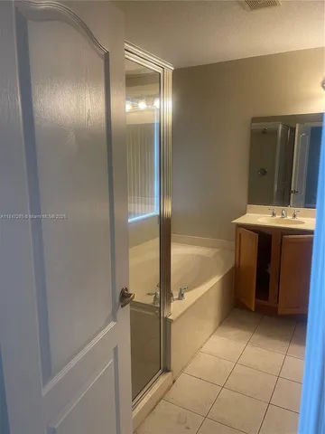 a bathroom with a bathtub and a sink