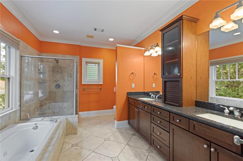 120 Park Place Decatur, GA 30030 - Photo 19 of 35 a spacious bathroom with a granite countertop tub sink shower and mirror