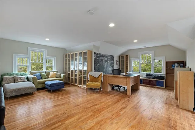 a work room with furniture and wooden floor