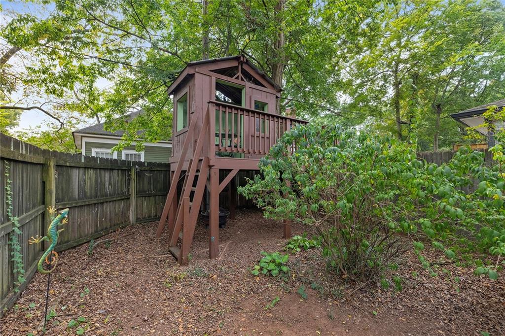 120 Park Place Decatur, GA 30030 - Photo 33 of 35 a view of a wooden house with a yard and large trees