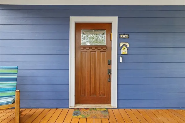 a view of entryway and gallery with wooden floor
