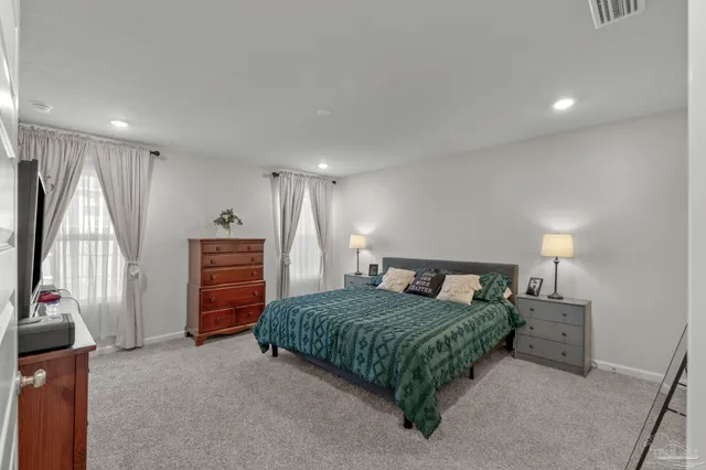 a bedroom with a bed and a walk in closet