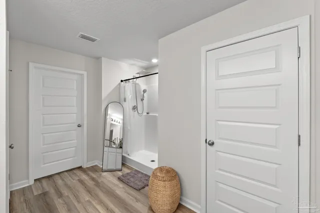 a view of a livingroom with closet and cabinet