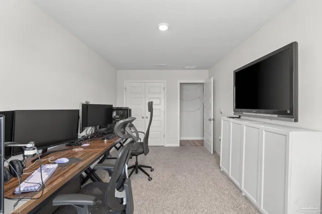 a view of a workspace with furniture