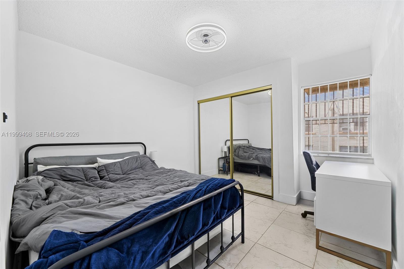 515 Southwest 3rd Street, Unit 6 Miami, FL 33130 - Photo 11 of 19 a bedroom with a large bed and a window