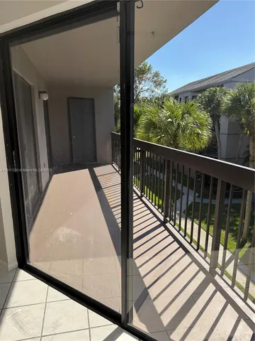 a balcony view with an outdoor space