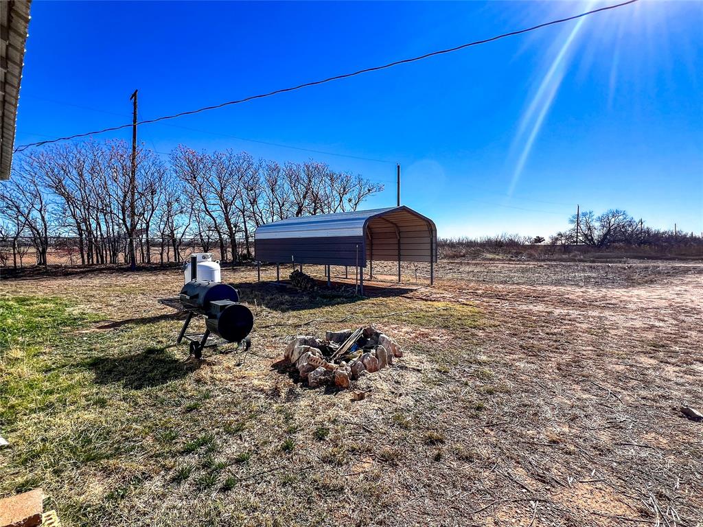 428 East 8th Street Aspermont, TX 79502 - Photo 2 of 12 a view of a backyard with a table and chairs