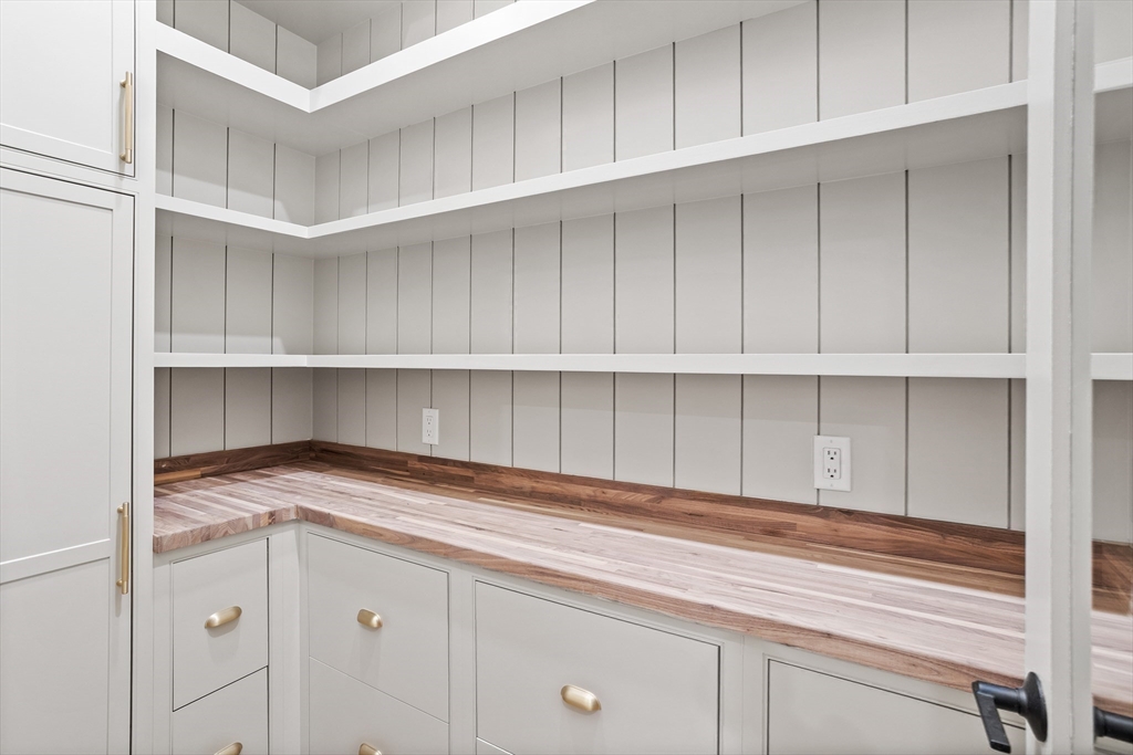 15 Peachtree Road Lexington, MA 02420 - Photo 21 of 42 a kitchen with white cabinets and a wooden floors