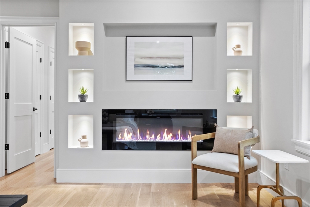 15 Peachtree Road Lexington, MA 02420 - Photo 24 of 42 a living room with furniture and a fireplace