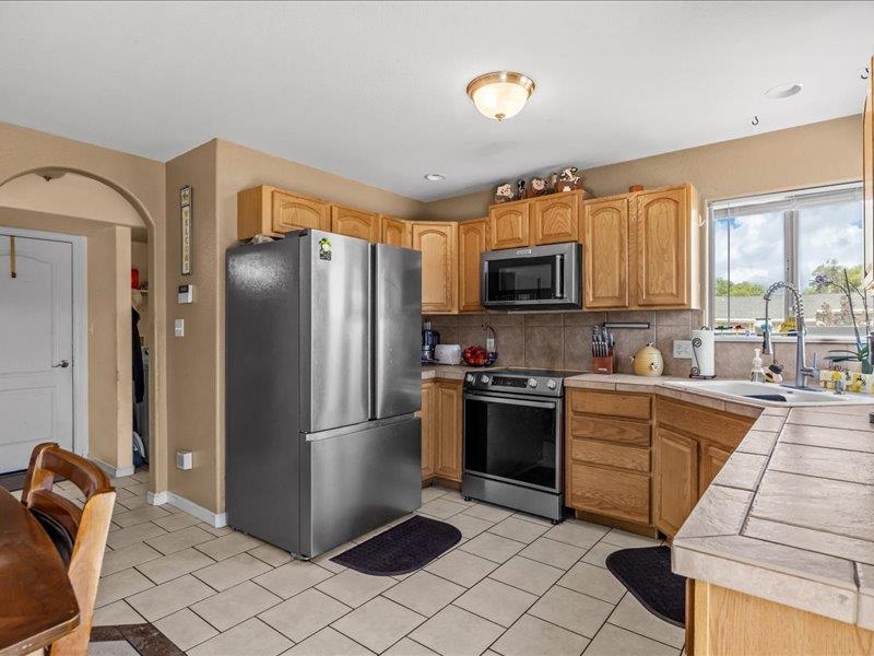 2860 B B 3/4 Road Grand Junction, CO 81503 - Photo 13 of 29 a kitchen with stainless steel appliances granite countertop a refrigerator stove and microwave