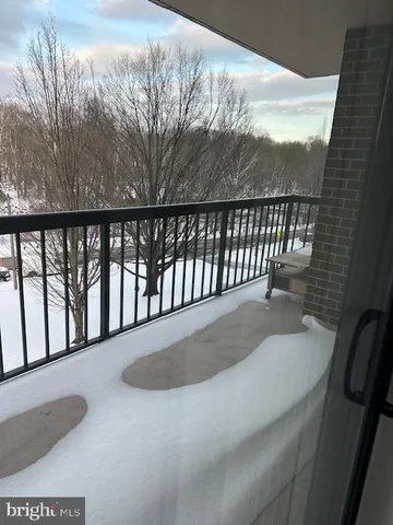 a view of balcony with furniture