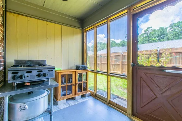 a bedroom with furniture and a window