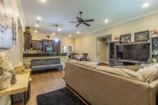 a living room with furniture and a flat screen tv
