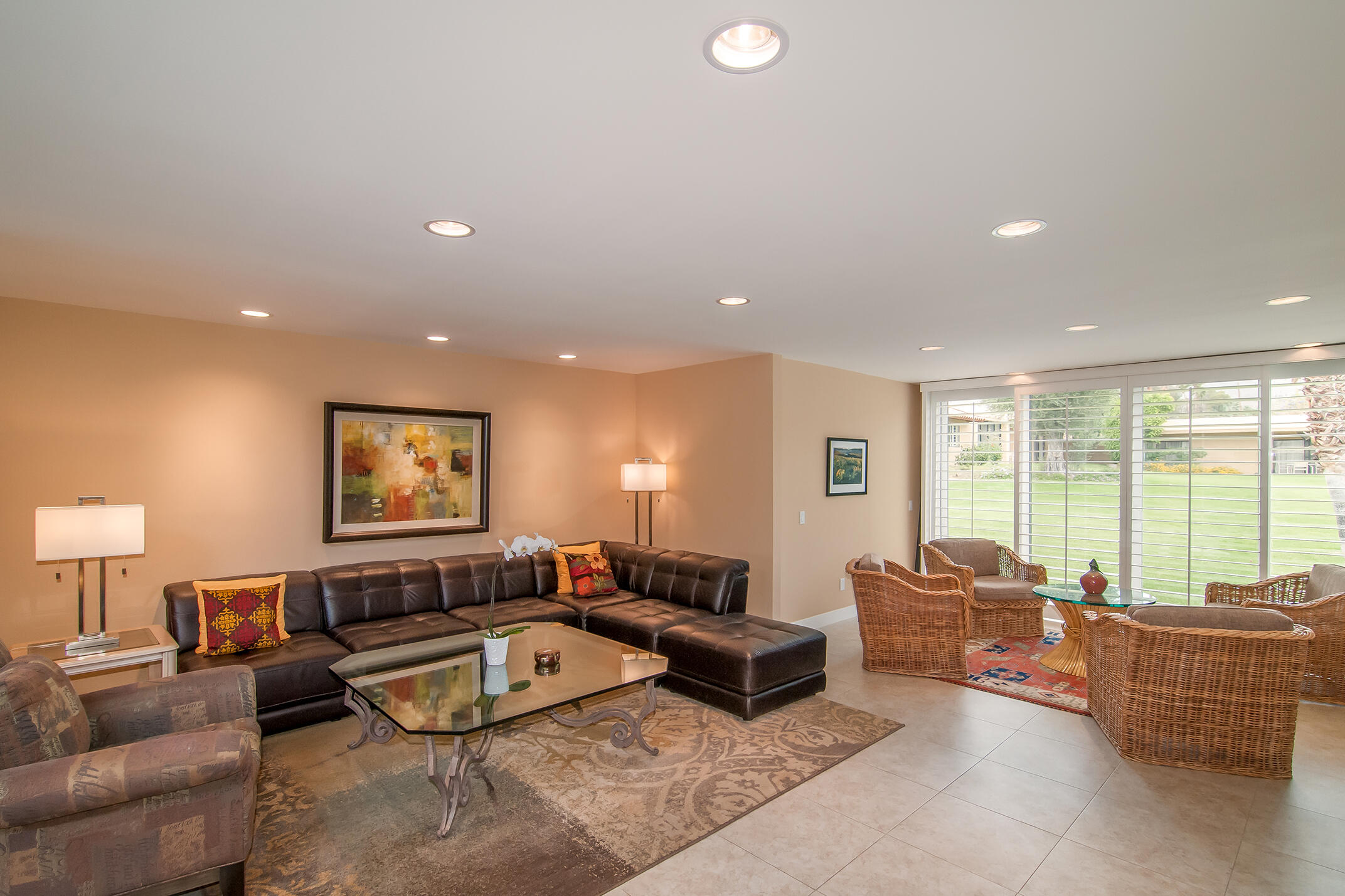 48275 Racquet Lane Palm Desert, CA 92260 - Photo 3 of 29 a living room with furniture and a large window